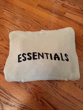 Essentials Knit hoodie size small has been worn in a beige taupe color